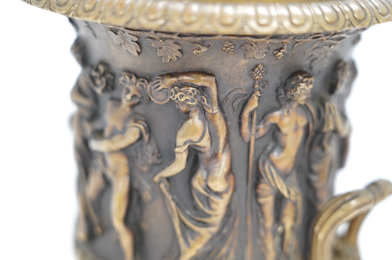 A mid 19th century bronze campana urn with classical figures, 22cm high. Condition - good